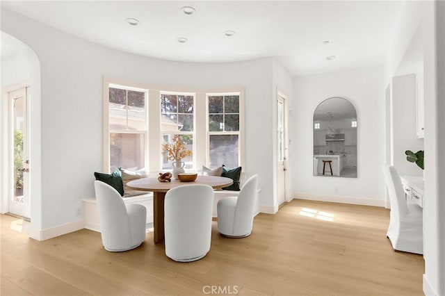 3 Seabluff, Newport Beach, CA 92660 - dining space with arched walkways, light wood-style floors, and recessed lighting