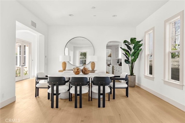 3 Seabluff, Newport Beach, CA 92660 - dining space featuring arched walkways and light wood-type flooring