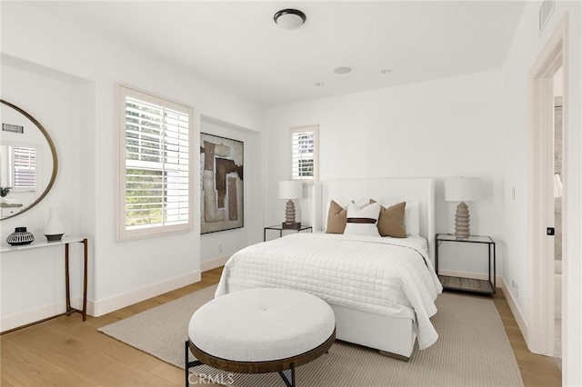 3 Seabluff, Newport Beach, CA 92660 - bedroom with light wood-type flooring and multiple windows