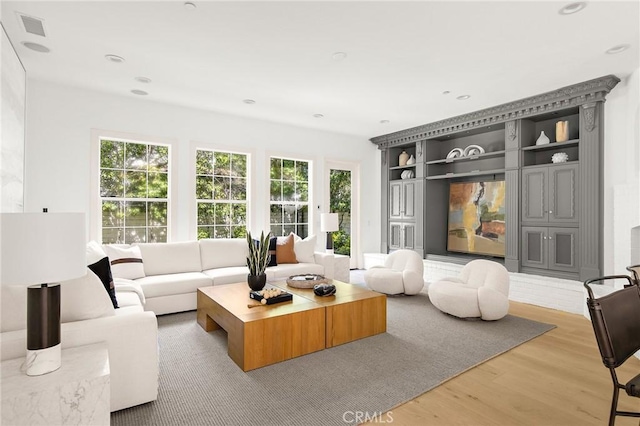 3 Seabluff, Newport Beach, CA 92660 - living room with light wood-style flooring, built in features, and recessed lighting