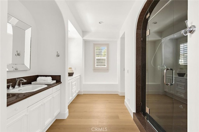 3 Seabluff, Newport Beach, CA 92660 - bathroom with vanity, a stall shower, and wood finished floors