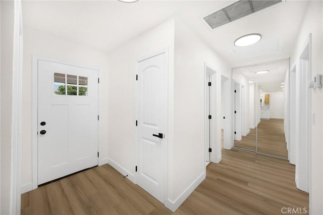 9737 Felipe Ave, Montclair, CA 91763 - hallway featuring light wood finished floors and attic access