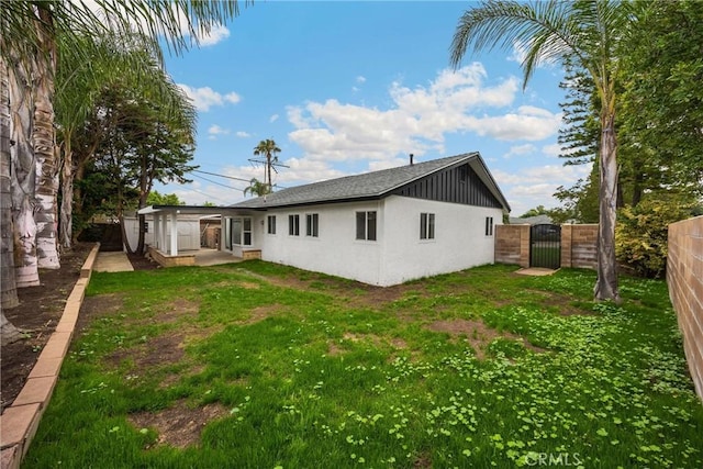 9737 Felipe Ave, Montclair, CA 91763 - rear view of house featuring a gate and stucco siding
