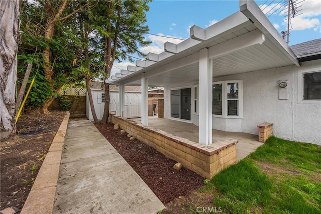 9737 Felipe Ave, Montclair, CA 91763 - view of home's exterior featuring stucco siding, a patio, and a shed