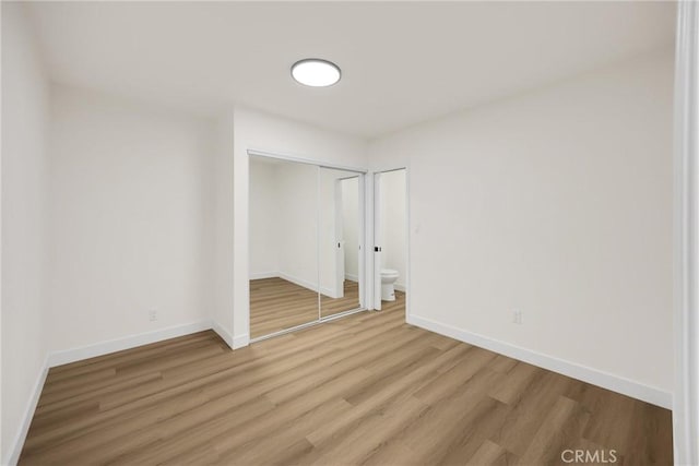 9737 Felipe Ave, Montclair, CA 91763 - unfurnished bedroom with light wood finished floors and a closet