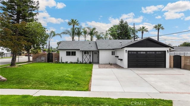9737 Felipe Ave, Montclair, CA 91763 - view of front of home featuring an attached garage, driveway, and stucco siding