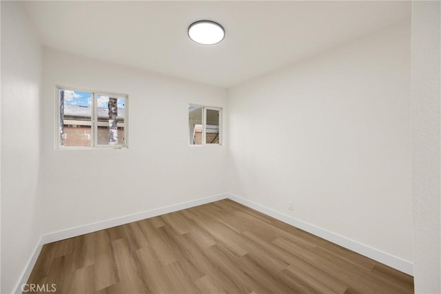 9737 Felipe Ave, Montclair, CA 91763 - spare room featuring wood finished floors and baseboards