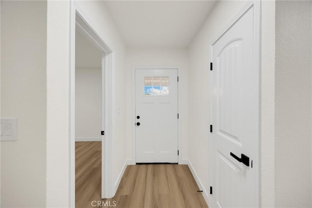 9737 Felipe Ave, Montclair, CA 91763 - doorway to outside with light wood-style floors and baseboards
