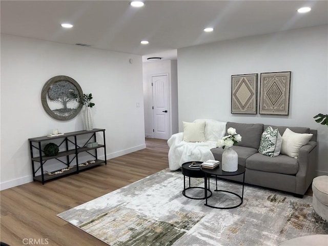 9737 Felipe Ave, Montclair, CA 91763 - living area featuring wood finished floors and recessed lighting