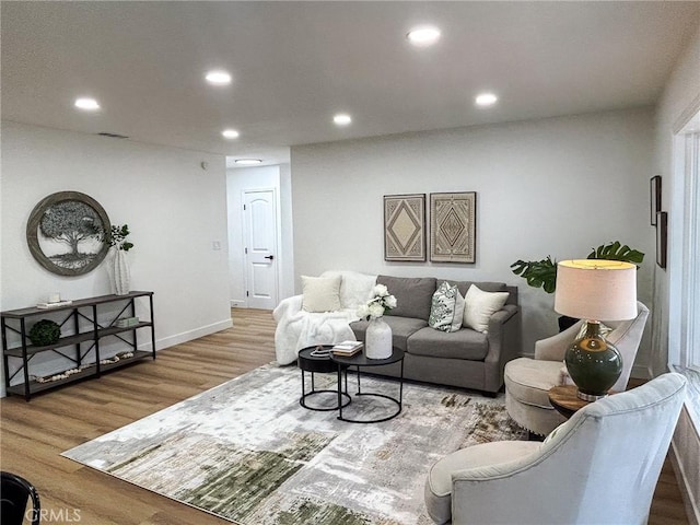 9737 Felipe Ave, Montclair, CA 91763 - living room featuring wood finished floors and recessed lighting