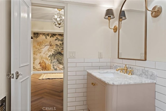 3492 Circle Rd, San Bernardino, CA 92405 - bathroom with vanity, tile walls, and wainscoting