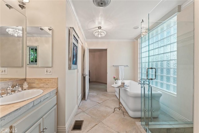 3492 Circle Rd, San Bernardino, CA 92405 - full bath featuring vanity, ornamental molding, a chandelier, baseboards, and a soaking tub