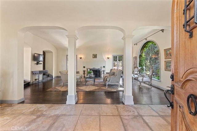 3492 Circle Rd, San Bernardino, CA 92405 - entryway with decorative columns, baseboards, and arched walkways