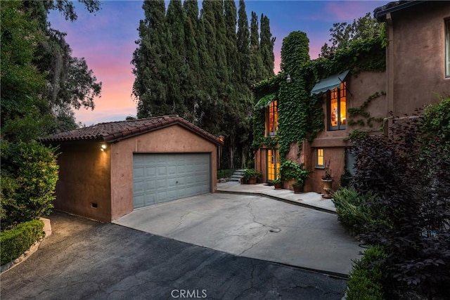 3492 Circle Rd, San Bernardino, CA 92405 - view of front of property featuring a detached garage, an outbuilding, and stucco siding