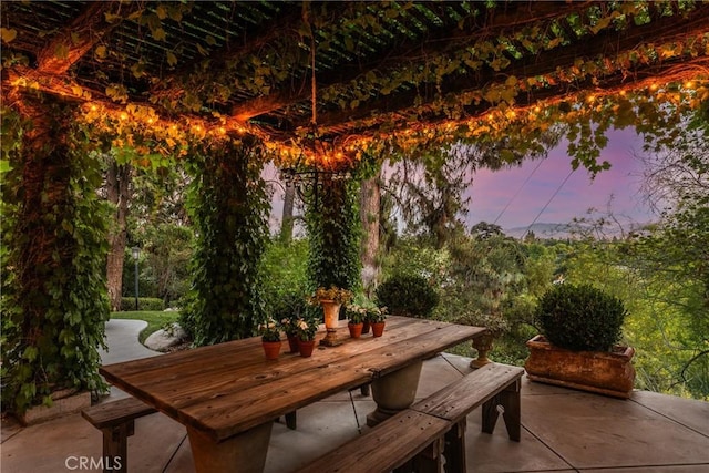 3492 Circle Rd, San Bernardino, CA 92405 - patio terrace at dusk featuring outdoor dining space and a patio area