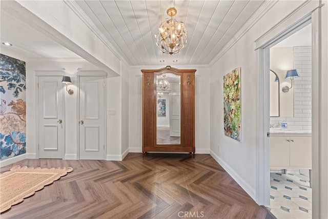3492 Circle Rd, San Bernardino, CA 92405 - foyer featuring a chandelier, crown molding, and baseboards