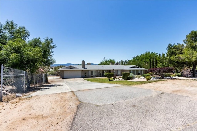 15799 Cromdale St, Hesperia, CA 92345 - ranch-style house featuring driveway, a garage, and a chimney