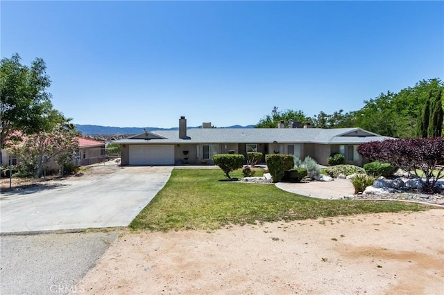 15799 Cromdale St, Hesperia, CA 92345 - single story home with driveway, an attached garage, a chimney, and a front yard