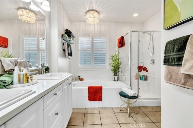 6038 Grace St, Chino, CA 91710 - full bathroom with a chandelier, vanity, a shower stall, a bath, and tile patterned floors