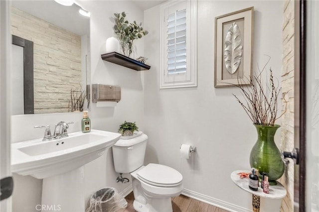 6038 Grace St, Chino, CA 91710 - bathroom with toilet, baseboards, wood finished floors, and a sink