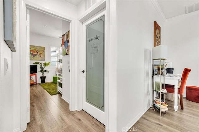 6038 Grace St, Chino, CA 91710 - hallway featuring ornamental molding, light wood-type flooring, a desk, and baseboards