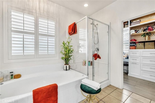 6038 Grace St, Chino, CA 91710 - bathroom with a stall shower, a bath, tile patterned floors, recessed lighting, and a spacious closet