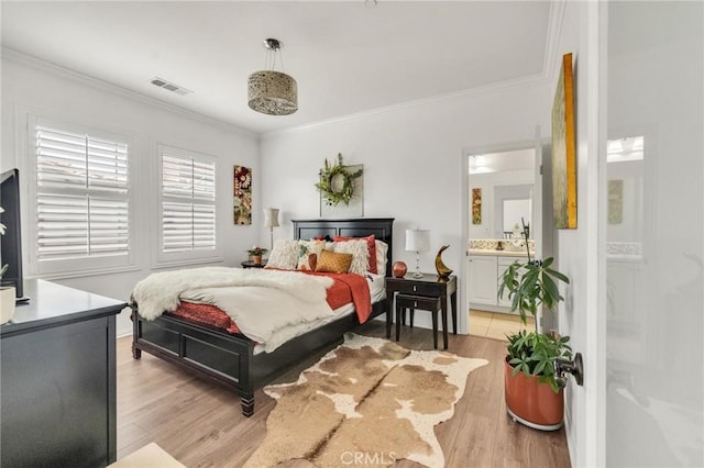 6038 Grace St, Chino, CA 91710 - bedroom with ornamental molding, light wood-style floors, and ensuite bathroom