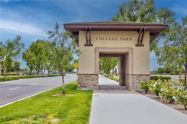 6038 Grace St, Chino, CA 91710 - doorway to property featuring stucco siding and stone siding