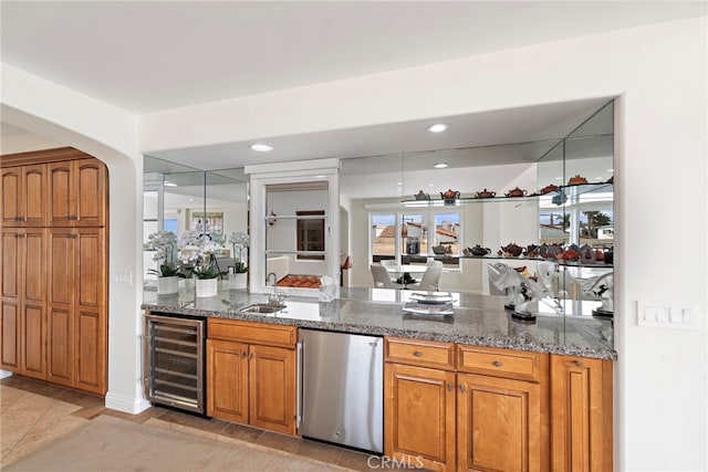 911 Buena Vis Unit 1, San Clemente, CA 92672 - indoor wet bar with wine cooler, refrigerator, recessed lighting, light tile patterned floors, and arched walkways
