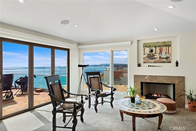 911 Buena Vis Unit 1, San Clemente, CA 92672 - carpeted living area featuring a water view, recessed lighting, and a high end fireplace
