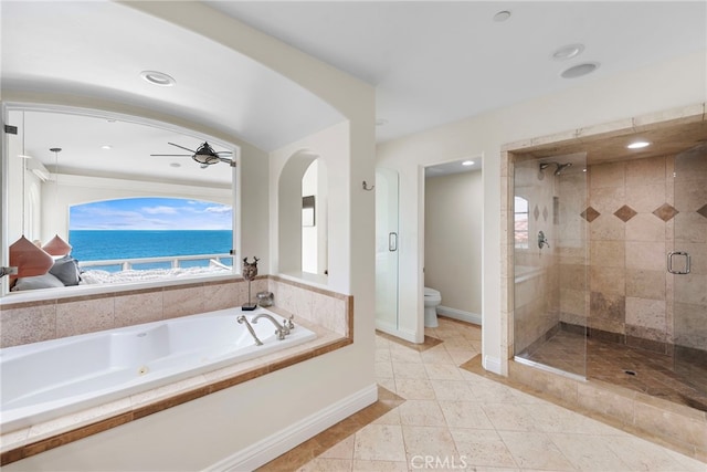 911 Buena Vis Unit 1, San Clemente, CA 92672 - full bath with a tub with jets, a shower stall, toilet, baseboards, and a ceiling fan