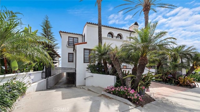 911 Buena Vis Unit 1, San Clemente, CA 92672 - view of front of property featuring a gate, stucco siding, and a tile roof
