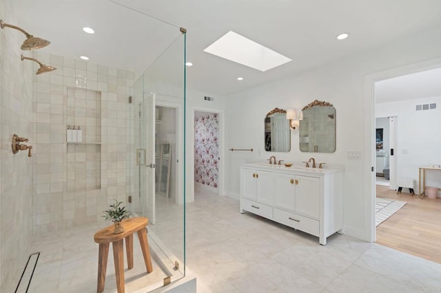 1368 Hymettus Ave, Encinitas, CA 92024 - full bathroom with a skylight, a shower stall, double vanity, and recessed lighting