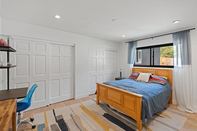 1368 Hymettus Ave, Encinitas, CA 92024 - bedroom featuring multiple closets, light wood-style floors, and recessed lighting