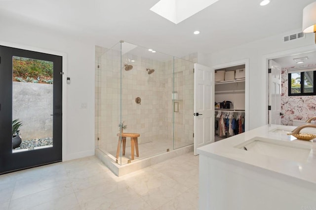 1368 Hymettus Ave, Encinitas, CA 92024 - full bath featuring a stall shower, a skylight, double vanity, a spacious closet, and recessed lighting