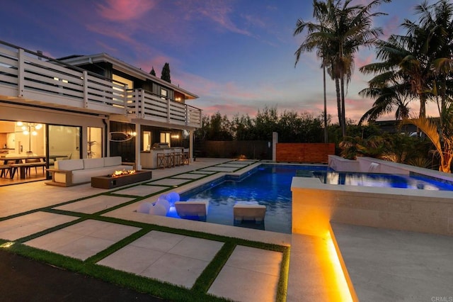 1368 Hymettus Ave, Encinitas, CA 92024 - pool at dusk featuring area for grilling, a patio area, an outdoor hot tub, and an outdoor living space with a fire pit