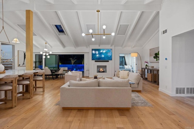 1368 Hymettus Ave, Encinitas, CA 92024 - living room with a chandelier and light wood-type flooring