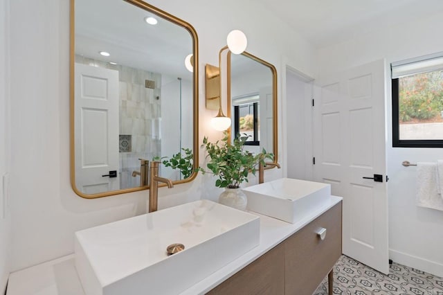 1368 Hymettus Ave, Encinitas, CA 92024 - full bathroom featuring plenty of natural light, tiled shower, double vanity, recessed lighting, and tile patterned flooring
