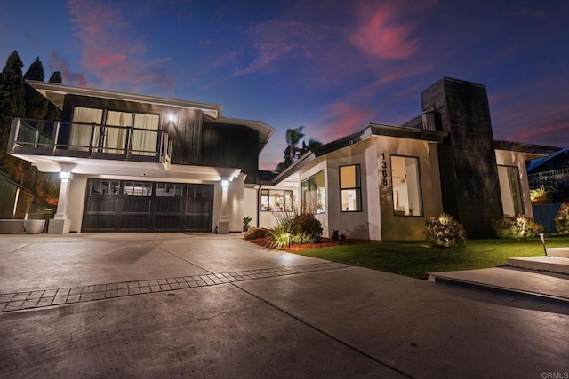 1368 Hymettus Ave, Encinitas, CA 92024 - contemporary home featuring a balcony, driveway, stucco siding, and an attached garage