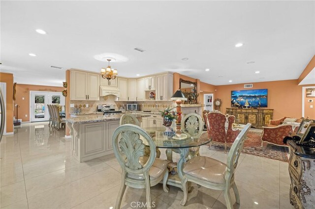16900 Mayall St, North Hills, CA 91343 - dining space with light tile patterned flooring, recessed lighting, and a chandelier