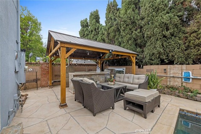 16900 Mayall St, North Hills, CA 91343 - fenced backyard featuring a gazebo, outdoor lounge area, a patio area, and exterior kitchen