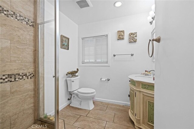 16900 Mayall St, North Hills, CA 91343 - full bath featuring a shower stall, vanity, toilet, tile patterned floors, and baseboards
