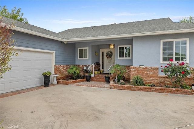 16900 Mayall St, North Hills, CA 91343 - ranch-style house featuring brick siding, an attached garage, concrete driveway, a shingled roof, and stucco siding