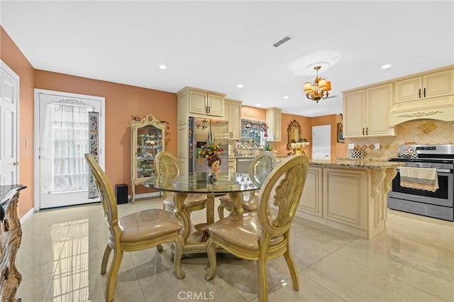 16900 Mayall St, North Hills, CA 91343 - dining room with a chandelier, light tile patterned flooring, and recessed lighting