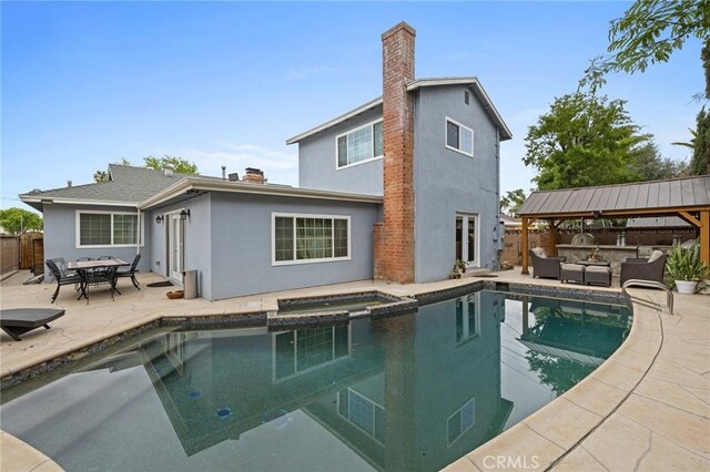 16900 Mayall St, North Hills, CA 91343 - rear view of property with an outdoor living space, stucco siding, a patio area, and a fenced backyard