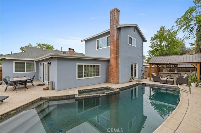 16900 Mayall St, North Hills, CA 91343 - rear view of house with an outdoor hangout area, a chimney, a patio, and stucco siding