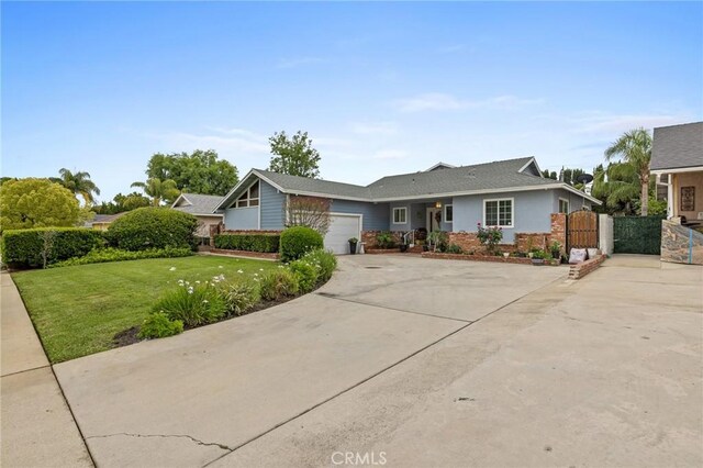 16900 Mayall St, North Hills, CA 91343 - view of front of property featuring concrete driveway, an attached garage, and a gate