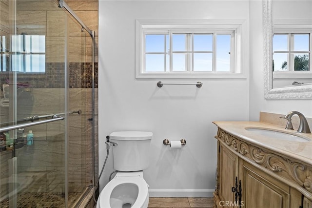 16900 Mayall St, North Hills, CA 91343 - bathroom featuring vanity, toilet, healthy amount of natural light, and baseboards