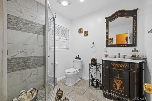 16900 Mayall St, North Hills, CA 91343 - full bath with toilet, vanity, a stall shower, tile patterned flooring, and baseboards