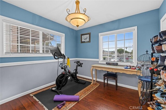 16900 Mayall St, North Hills, CA 91343 - exercise area with hardwood / wood-style floors, plenty of natural light, and baseboards